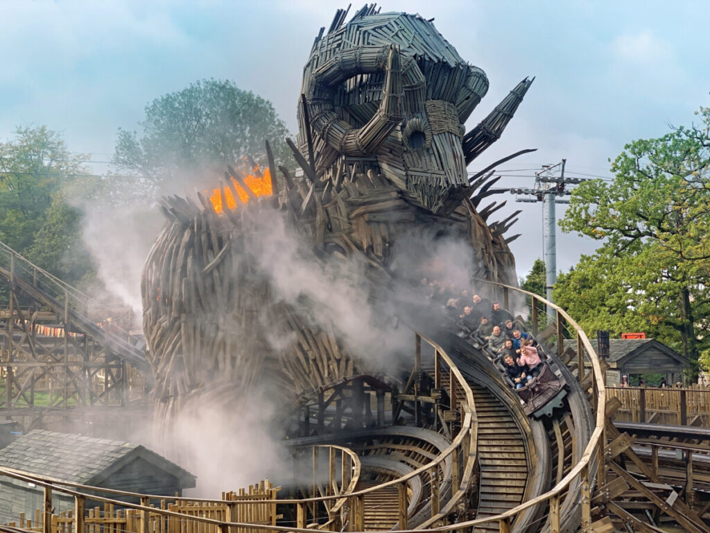 Members of the public smile and laugh whilst riding a rollercoaster at alton towers