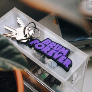purple and black keyring with words brum forever attached to a set of keys